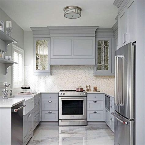 light gray kitchen cabinets with stainless steel appliances|light gray backsplash tile photos.